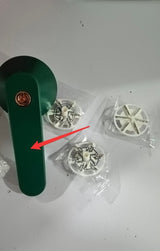 USB Rechargeable Lint Remover with replacement blades on a white surface.