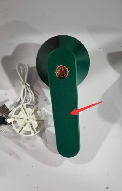 USB Rechargeable Lint Remover with power button and USB charging cable on a white background.