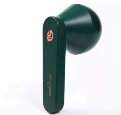 USB Rechargeable Lint Remover in green color, designed for removing lint and fuzz from fabrics.